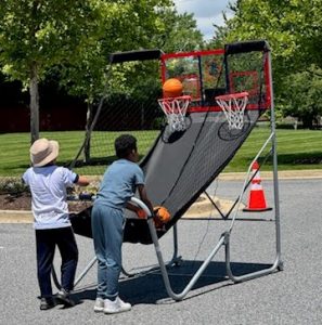 Kids playing basketball hoops